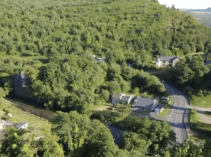 Wooded hillside with river valley