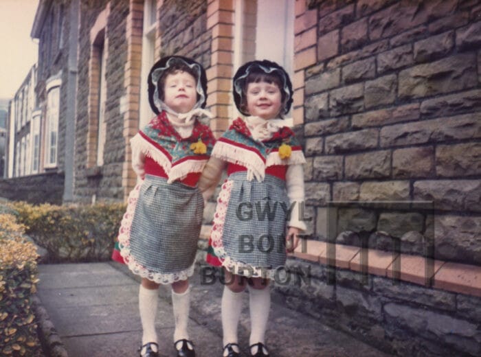 Twins in Welsh dresses